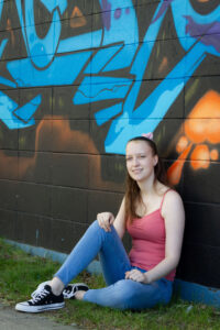 Saskatoon Seniors Casual Portraits female graffiti wall, jeans, tank top